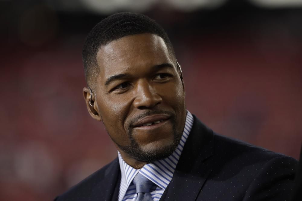 This Jan. 19, 2020 file photo shows Michael Strahan before the NFL NFC Championship football game between the San Francisco 49ers and the Green Bay Packers in Santa Clara, Calif. Strahan will be among the crew on Blue Origin's next flight to space.
