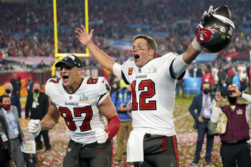 Tampa Bay Buccaneers tight end Rob Gronkowski, left, and quarterback Tom Brady (12) celebrate after the NFL Super Bowl 55 football game against the Kansas City Chiefs in Tampa, Fla., Feb. 7, 2021.