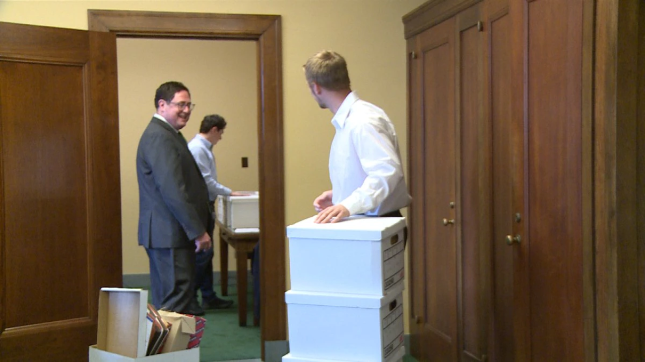 Mike Flood and his team pack up his office at the State Capitol.