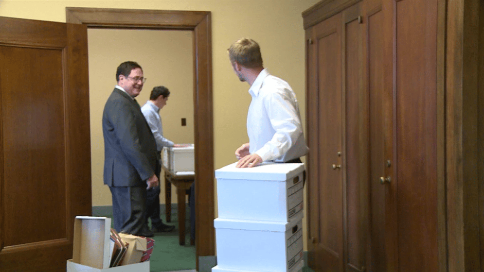 Mike Flood and his team pack up his office at the State Capitol.