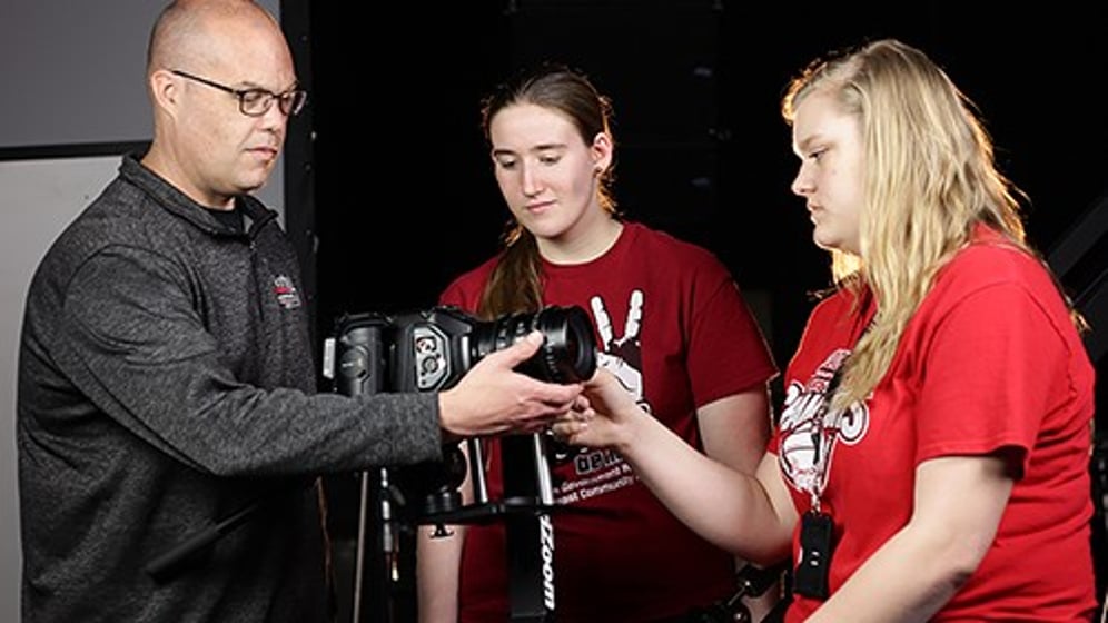 Brian Anderson, media arts – broadcasting instructor at Northeast Community College, (left) works with students in the Broadcasting studio on the Norfolk campus.