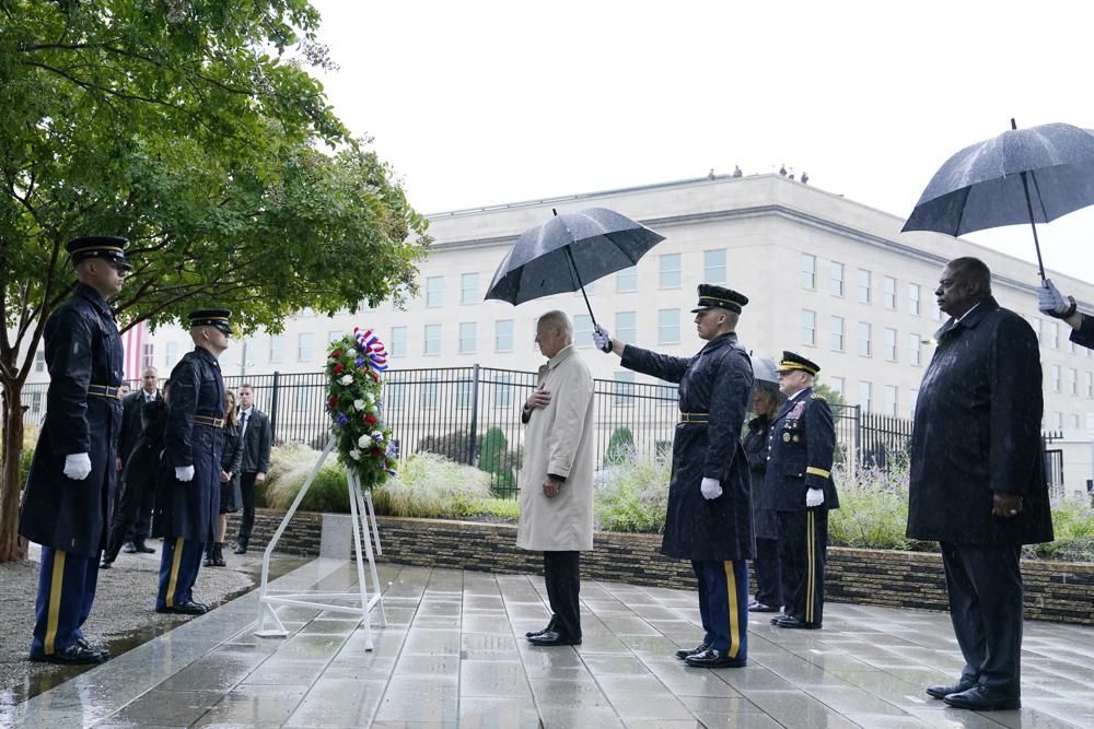 President Joe Biden participates in a wreath laying ceremony while visiting the Pentagon in Washington, Sunday, Sept. 11, 2022, to honor and remember the victims of the September 11th terror attack.