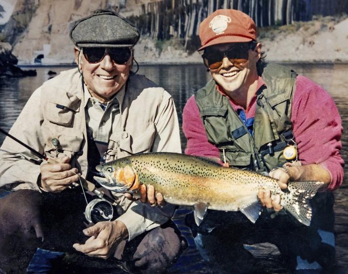 In this photo provided by Terry Gunn, Lehman Beardsley, left, and Gunn, who guides fishing trips, pose with a rainbow trout at Lees Ferry near Marble Canyon, Ariz., Nov 7, 1987.
