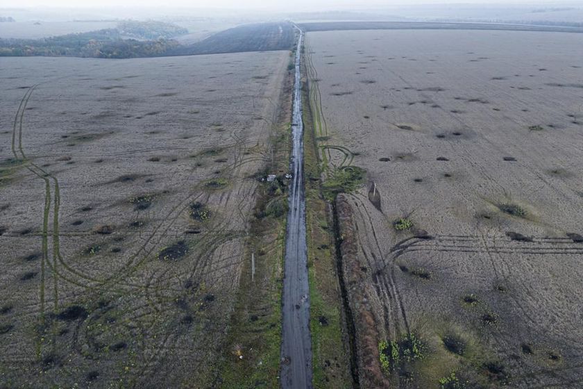 Artillery craters are seen in the field from an arial view in the recently liberated area of Kharkiv region, Ukraine, Friday, Sept. 30, 2022.