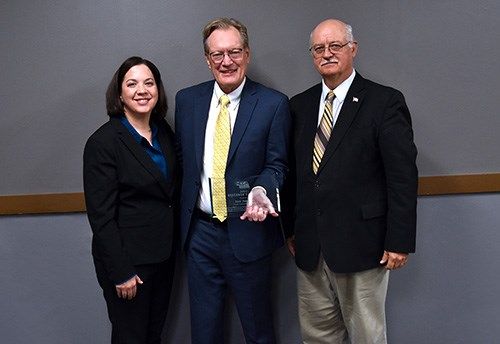 Dirk Petersen, a member of the Northeast Community College Board of Governors (center) is presented the 2022 Nebraska Community College Association’s Governor’s Award.
