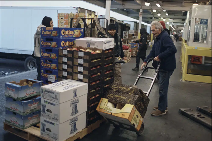 People shop for fruits and vegetables at S. Katzman Produce at the Hunts Point Produce Market on Tuesday, Nov. 22, 2022, in the Bronx borough of New York.