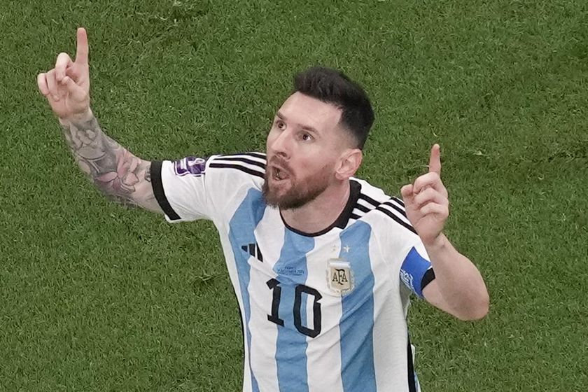 Argentina's Lionel Messi celebrates scoring his side's first goal during the World Cup final soccer match between Argentina and France at the Lusail Stadium in Lusail, Qatar, Sunday, Dec. 18, 2022.