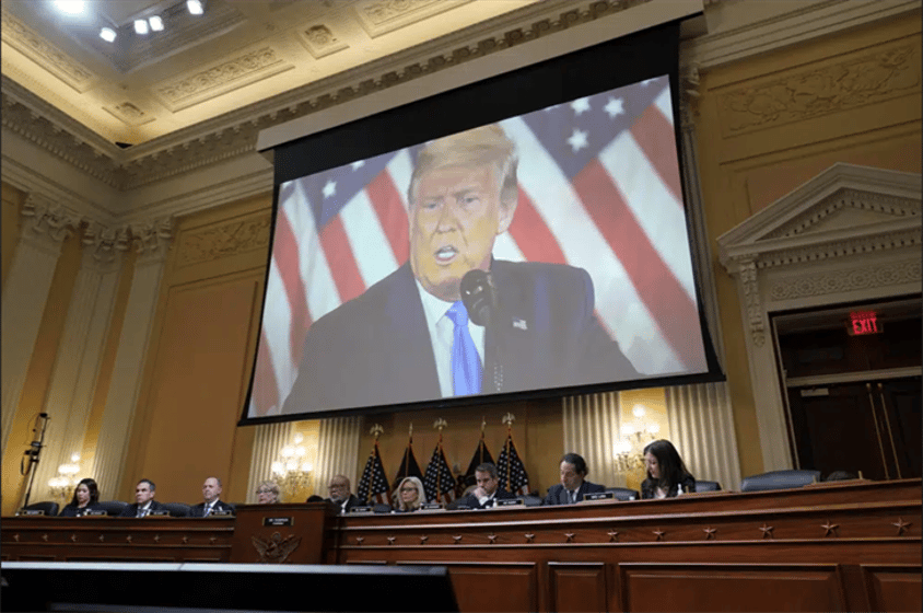 A video of former President Donald Trump is shown on a screen, as the House select committee investigating the Jan. 6 attack on the U.S. Capitol holds its final meeting on Capitol Hill in Washington, Monday, Dec. 19, 2022.