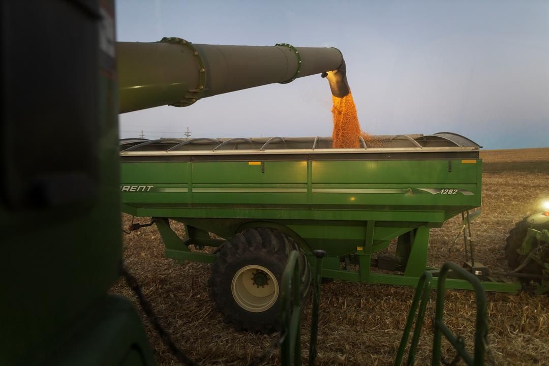 Farmer Jason Othmer unloads corn into a grain cart as he harvests near Vesta, an unincorporated community in Johnson County in southeast Nebraska on Tuesday, Oct. 18.