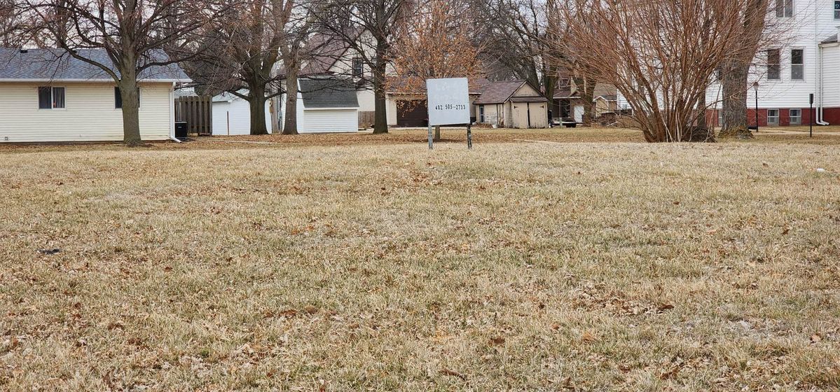 All that remains from the “Pink Murder House,” as locals remember it, is a vacant lot with a for sale sign. The two-level duplex was demolished in 2008.