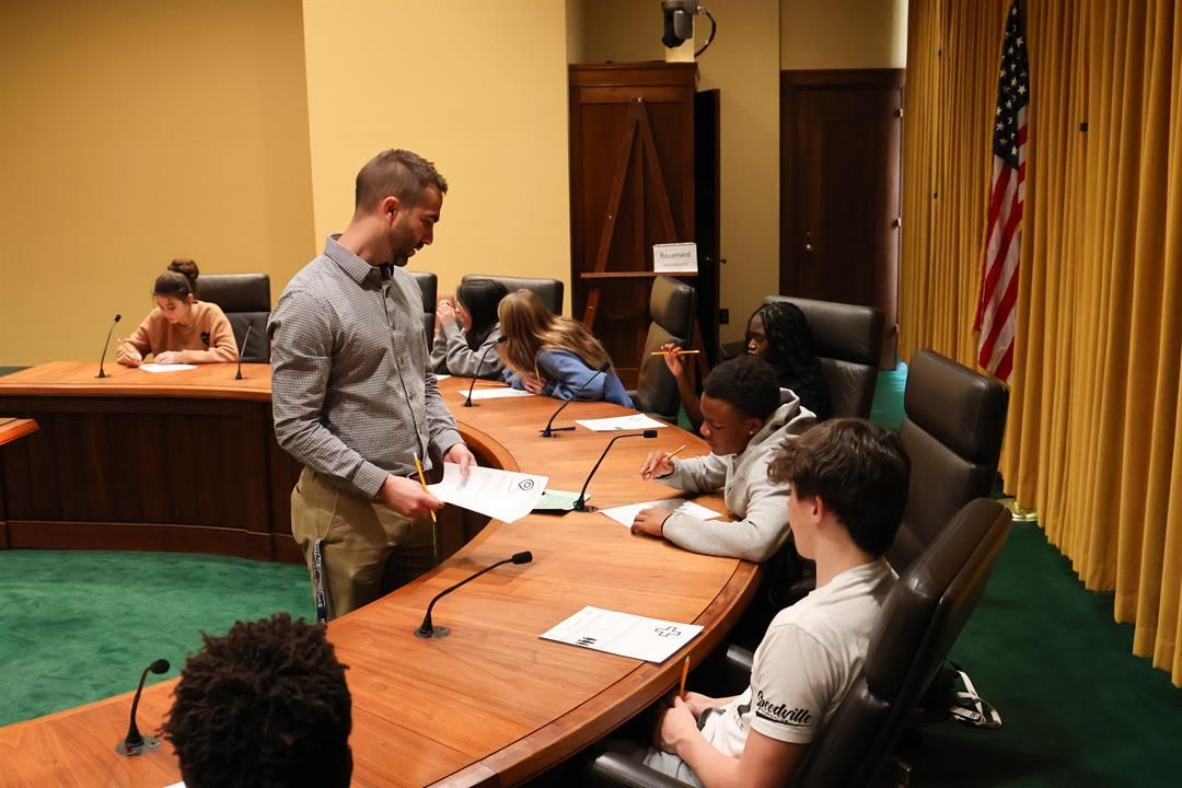 Nick Smith, a teacher licensed in Texas, answers a student's question during a field trip to the Nebraska State Capitol in Lincoln on April 18, 2024.