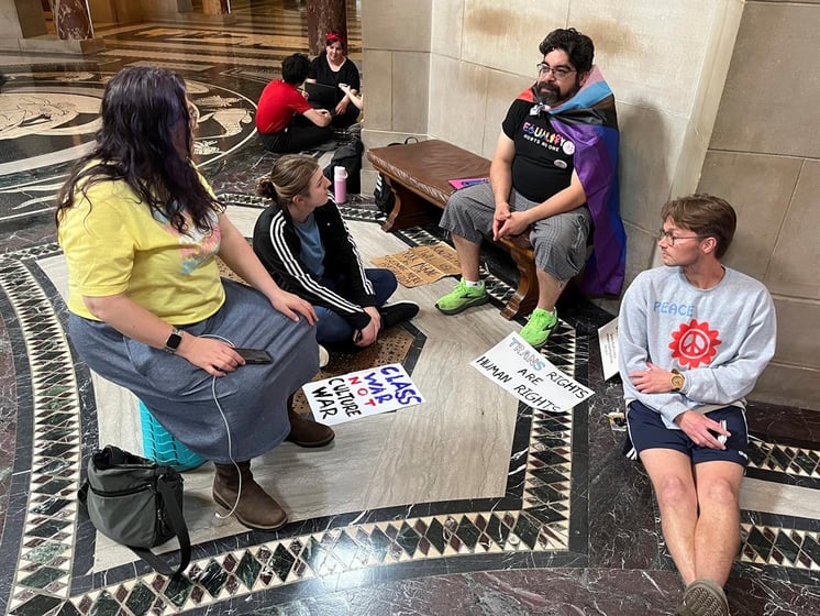 Protesters gather outside the legislative chamber at the State Capitol on Tuesday, April 22, 2025, in Lincoln, Neb. (AP Photo/Margery Beck)