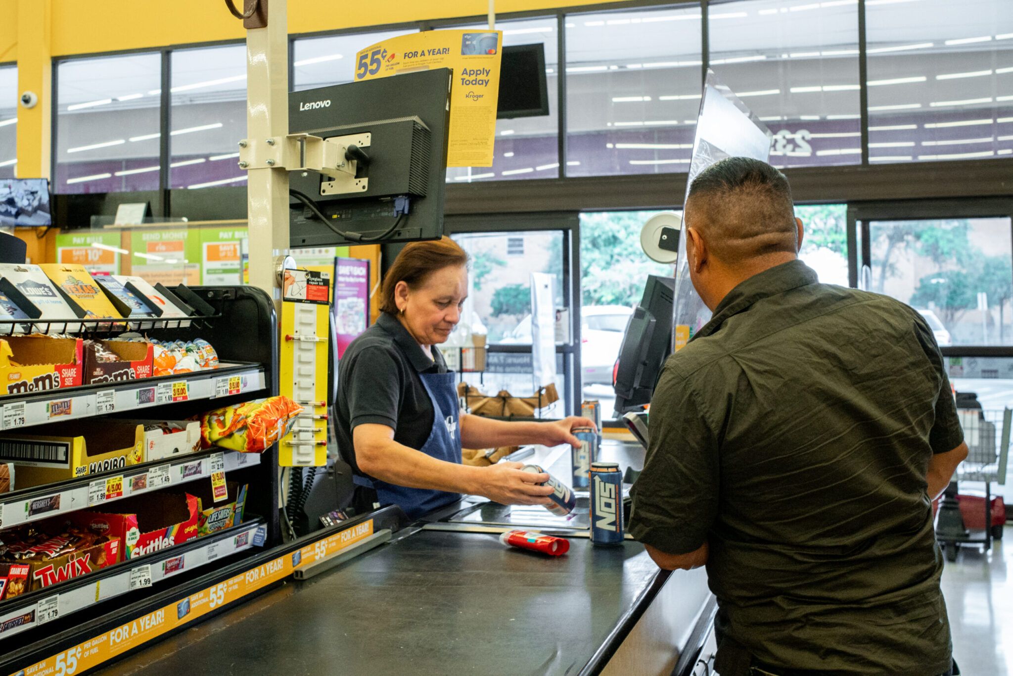 A customer is rung up by a cashier in a grocery store on July 15, 2022, in Houston, Texas. (Brandon Bell/Getty Images)
