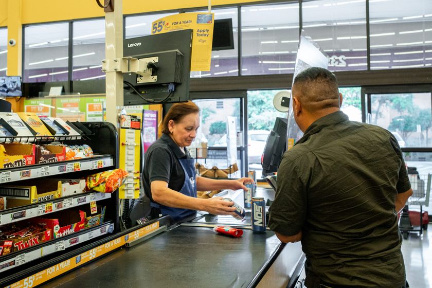 A customer is rung up by a cashier in a grocery store on July 15, 2022, in Houston, Texas. (Brandon Bell/Getty Images)