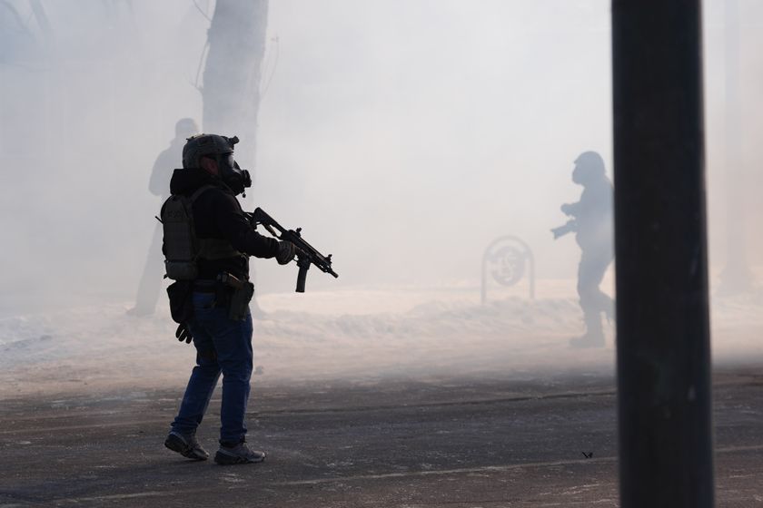 Federal immigration officers deploy tear gas after a shooting in Minneapolis, on Saturday, Jan. 24, 2026. (AP Photo/Abbie Parr)
